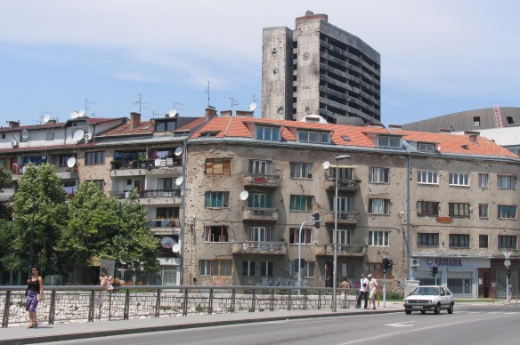 This is the bridge in Sarajevo where a tragic real-life love story happened in 1993.  I took this photo in 2005.  At that time only a small bow and dried flower bouquet marked the incident.