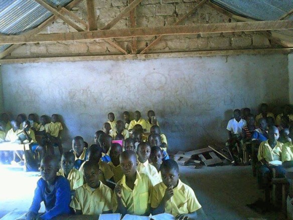 The Kamser Elementary School.  Crowded conditions not conducive to learning. There are 450 students at two schools like this one and they are requesting 150 bench desks to accommodate the students, many of whom sit on the floor. 