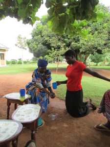 Neighbour helps Josephine wash her hands before we have afternoon tea. 